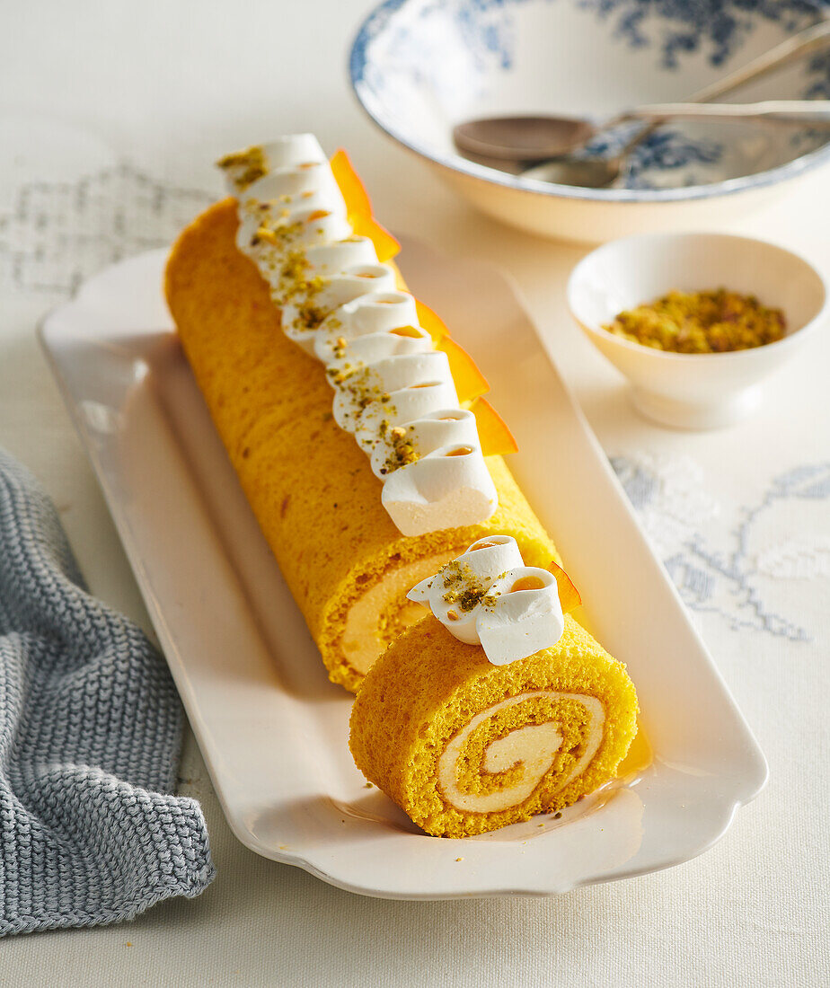 Pumpkin roulade with marzipan cream filling and cinnamon
