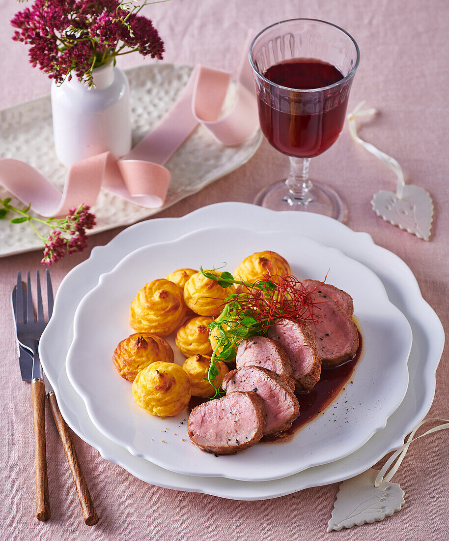 Pork fillet with wine sauce and duchess potatoes