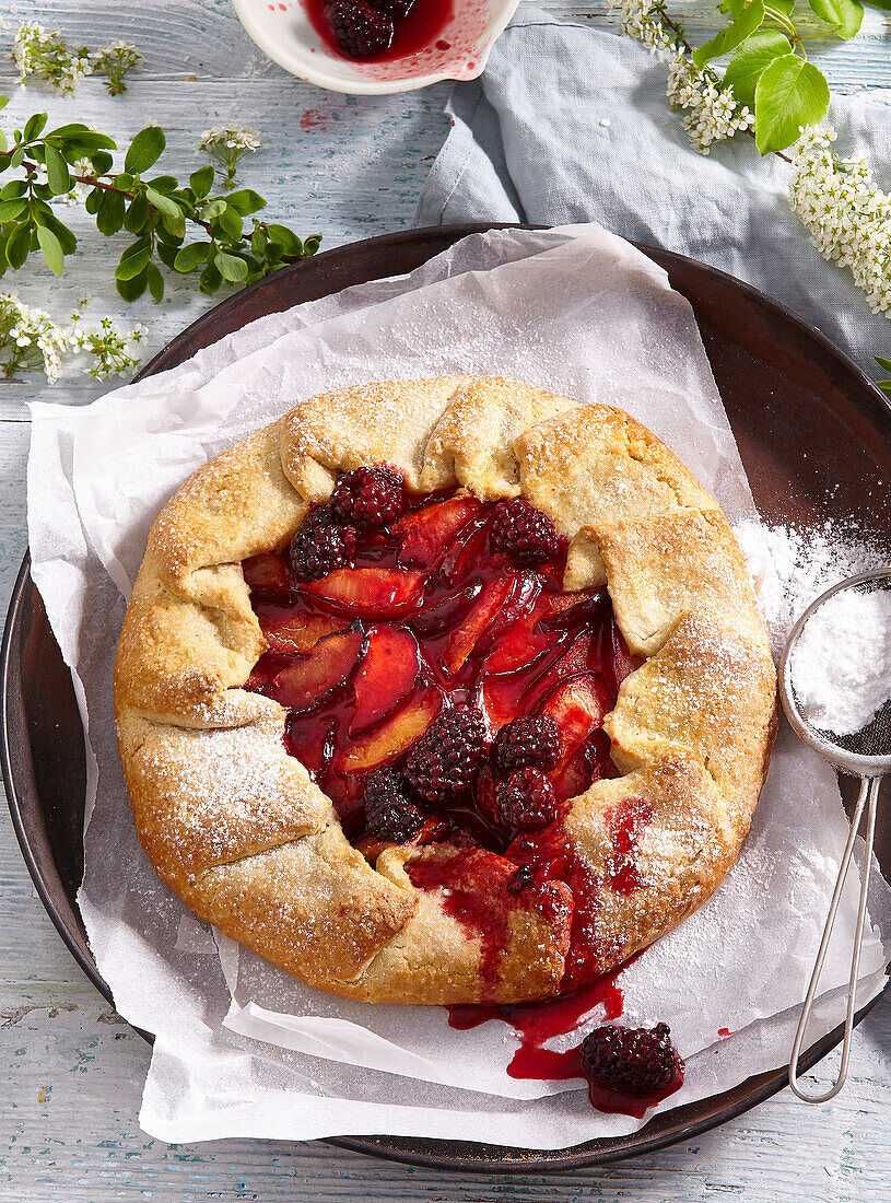 Peach galette with blackberries and almonds