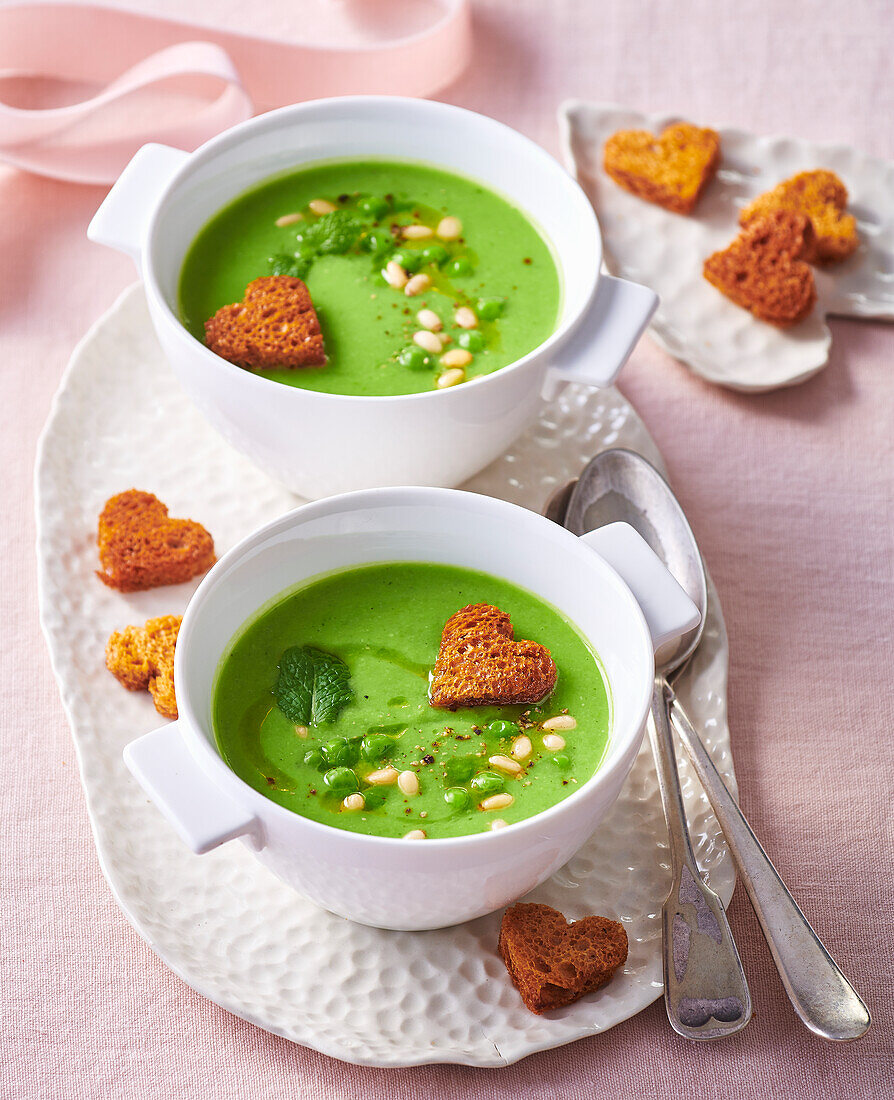 Pea soup with mint, pine nuts and heart-shaped croutons