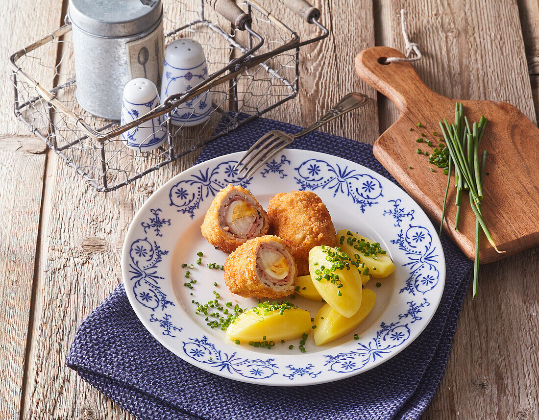 Beef roulades with egg filling and potatoes