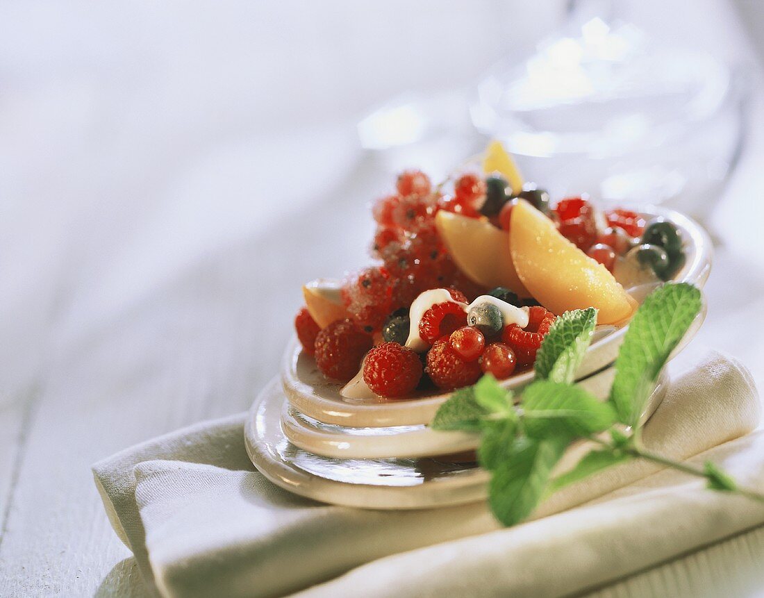 Colourful plate of berries with yoghurt mousse