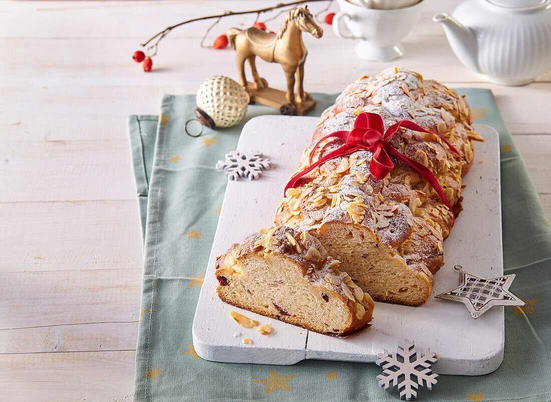 Christmas stollen with almonds, candied lemon peel and cranberries