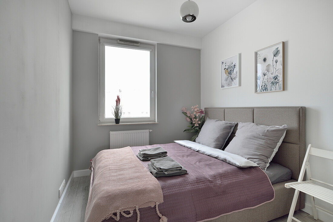 Bedroom with double bed and grey walls