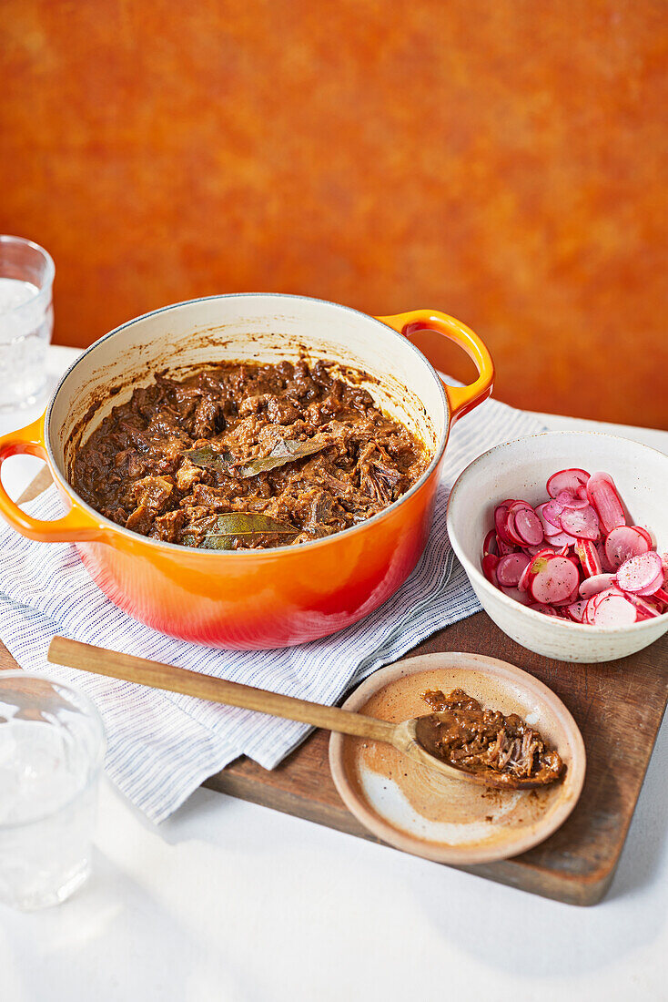 Goat meat ragout with pickled radishes
