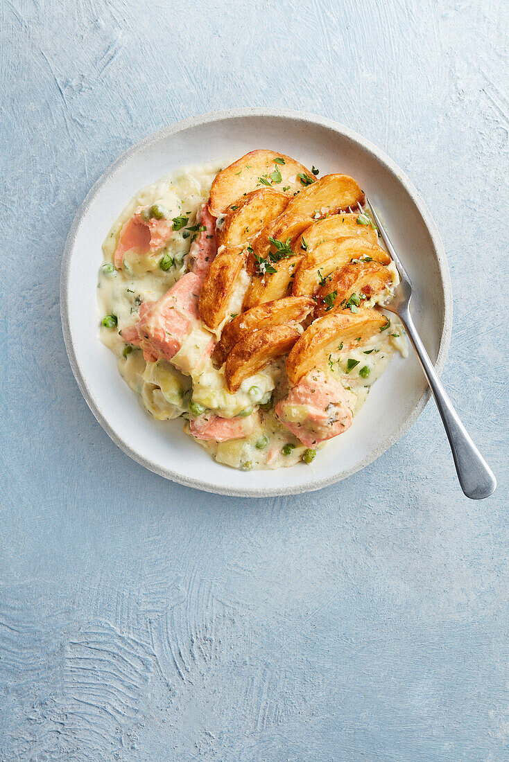Salmon casserole with potato wedges and Mornay sauce