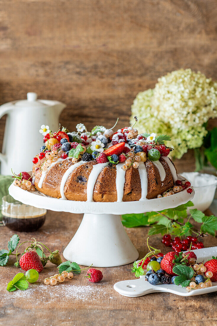 Bundt cake with summer berries and icing