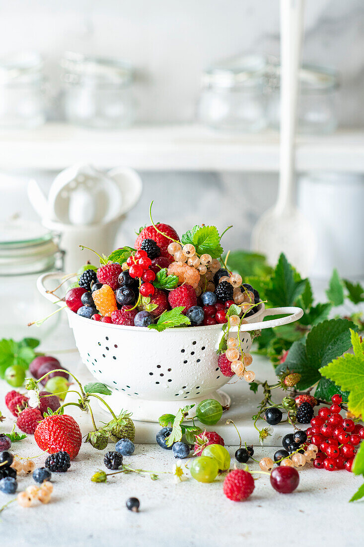 Fresh, colourful summer berries in a sieve