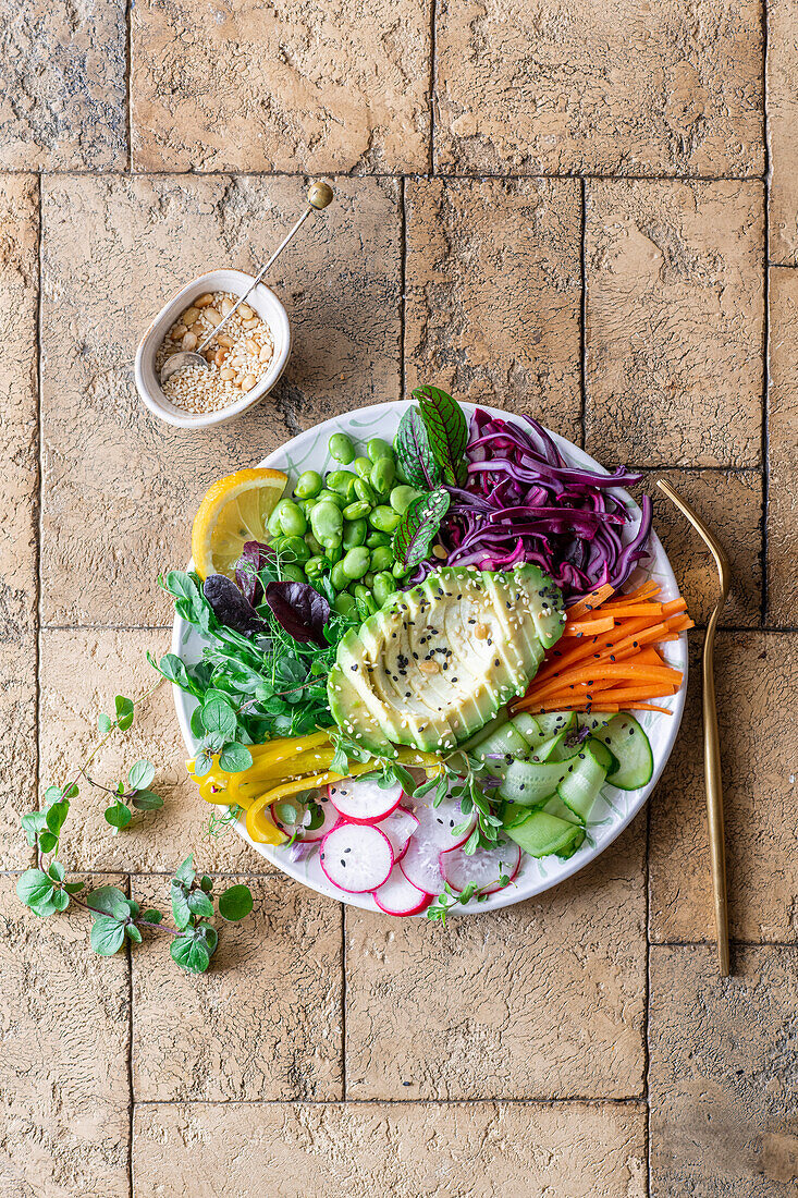 Buddha bowl with vegetables, pulses and sesame dressing