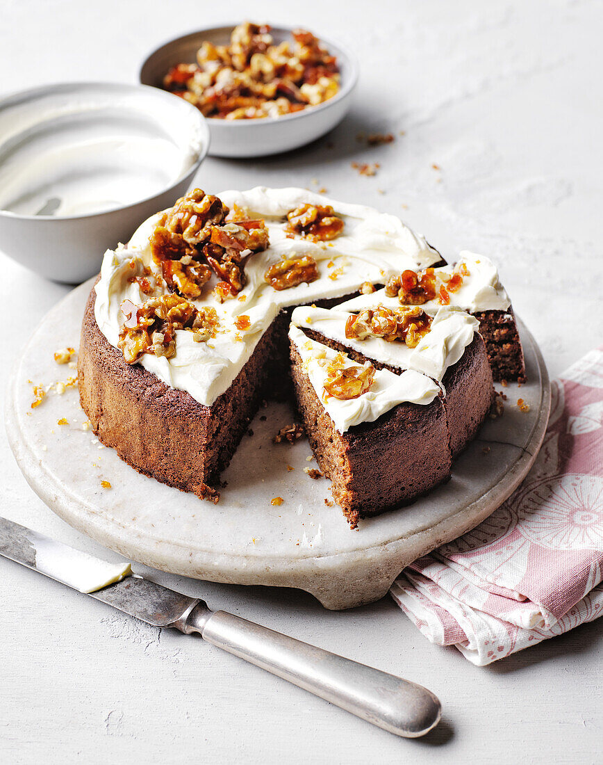 Walnut cake with cream cheese frosting and caramelised nuts