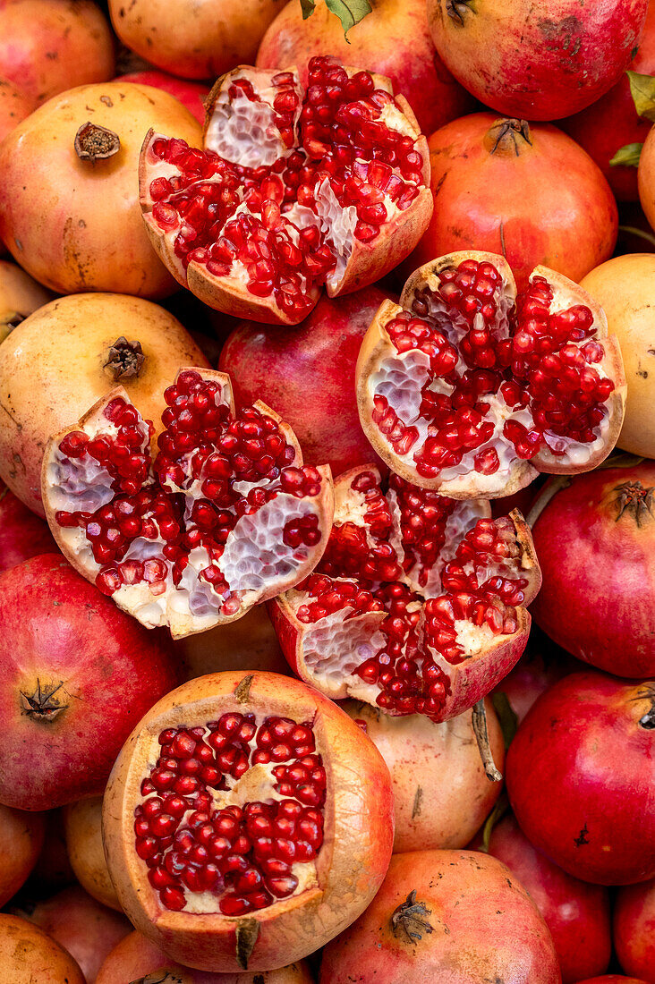 Pomegranates whole and broken open