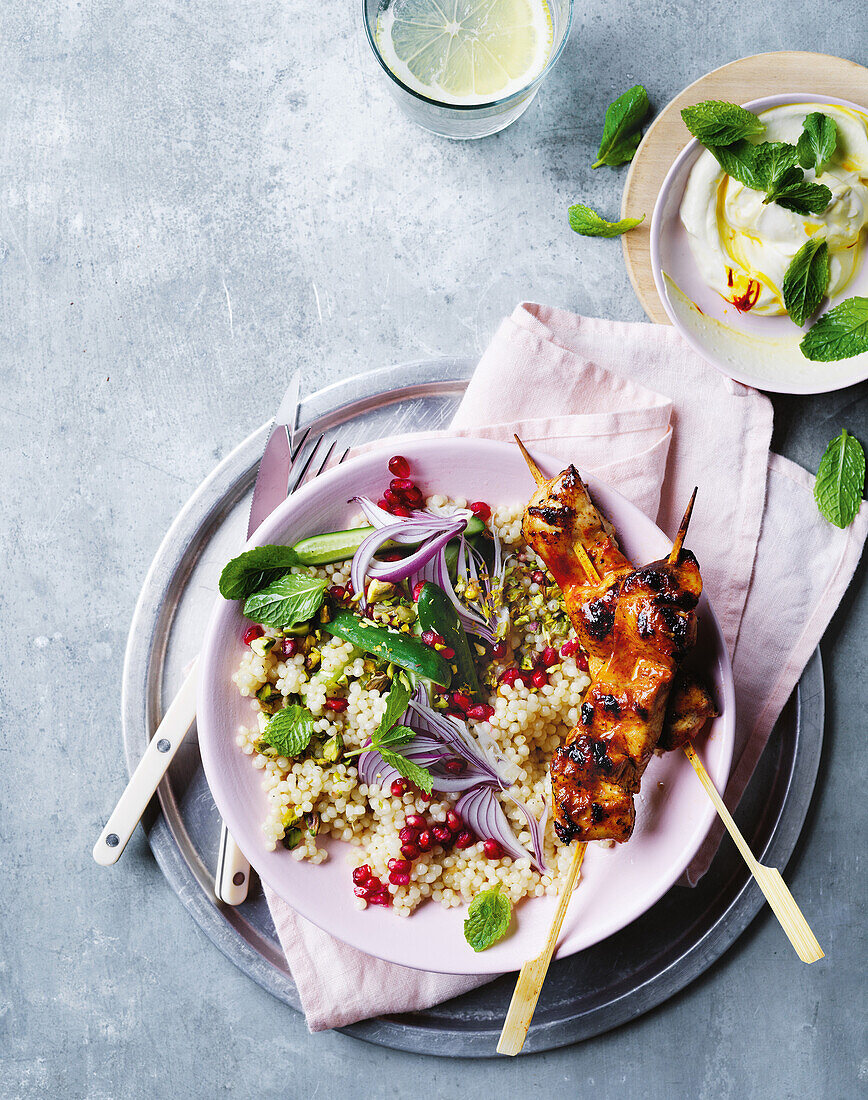 Marinated chicken skewers with saffron couscous and harissa yoghurt