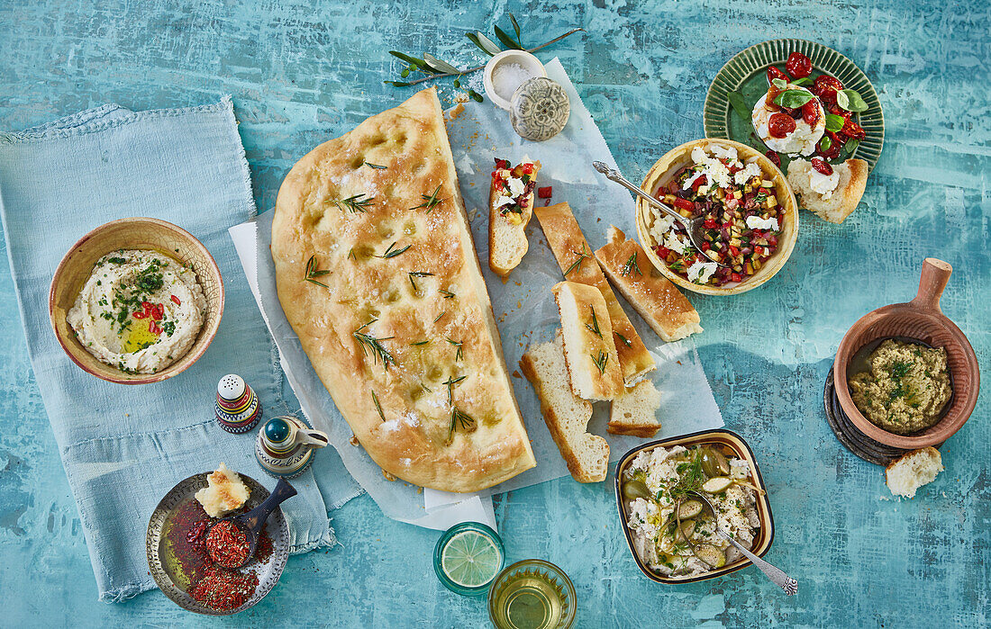 Ligurian potato focaccia with dips, tapenade and spices