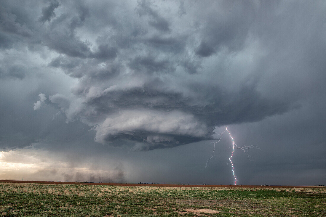 Supercell thunderstorm with lightning strike, Texas, USA