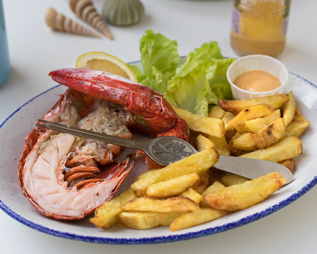 Lobster with chips and cocktail sauce
