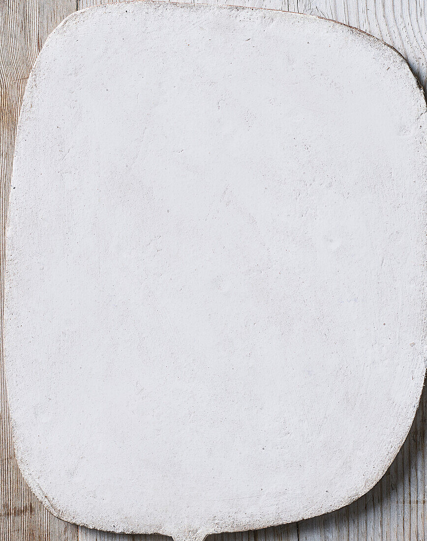 Blank slate plate on a wooden base