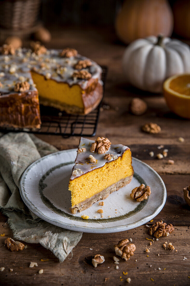 Pumpkin cheesecake with icing and walnuts