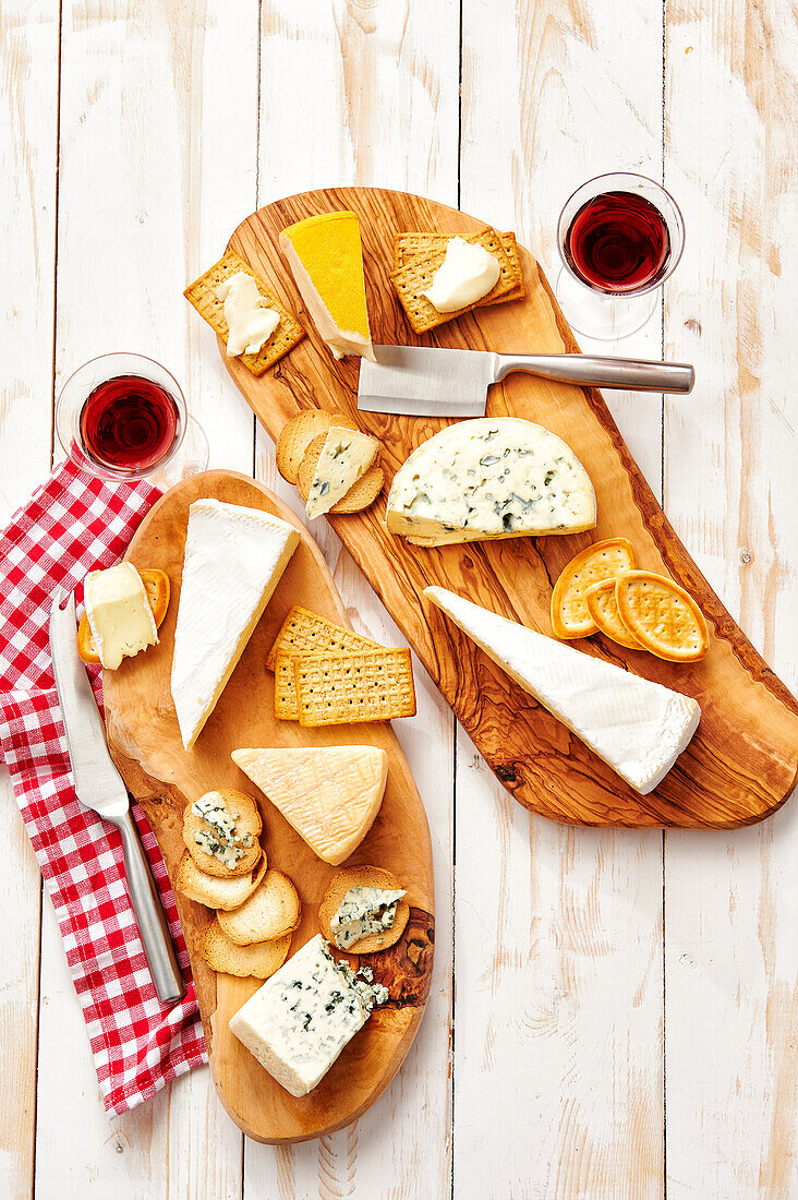 Cheese platter with French cheeses, crackers and red wine