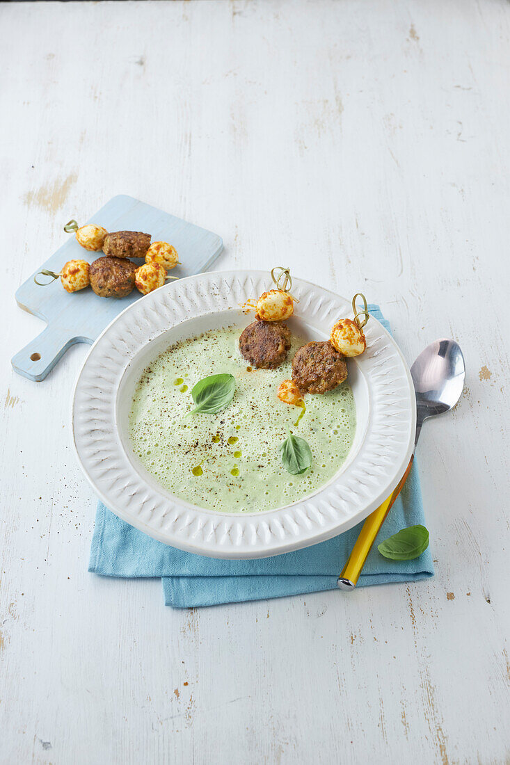 Courgette soup with veggie meatballs and mozzarella