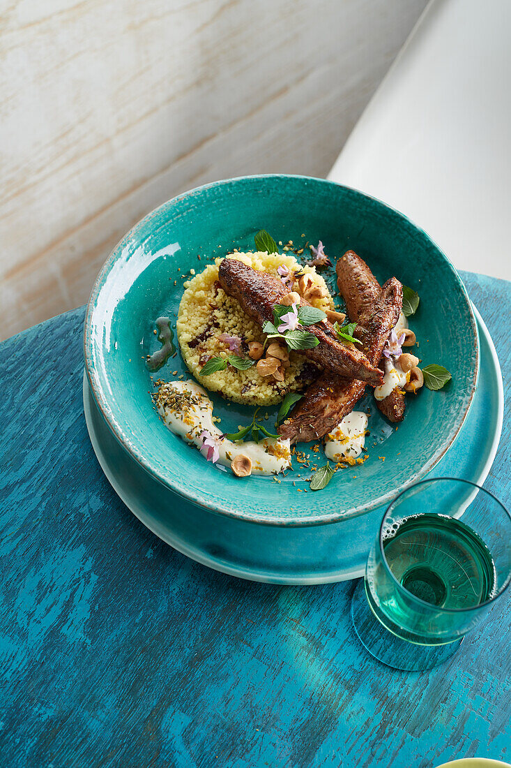 Grilled Baharat lamb fillets and couscous with dates