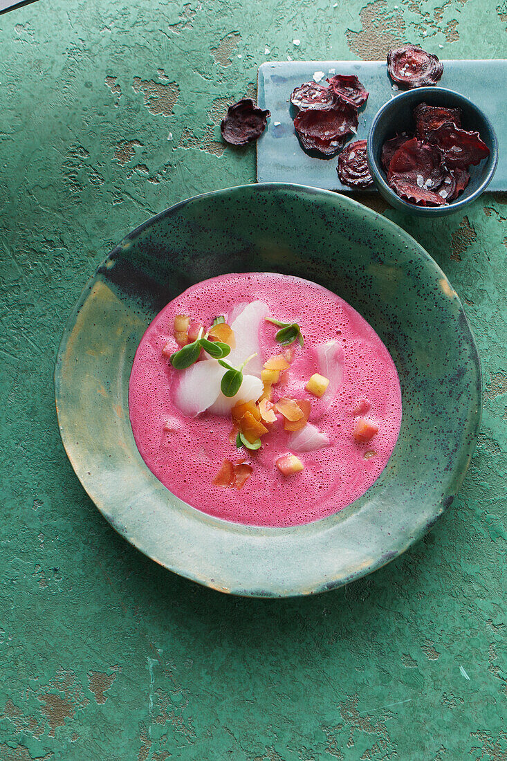 Cream of beetroot soup with bottarga and caramelised apples