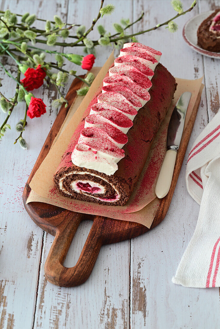 Chocolate sponge roll with cherry and cream cheese filling