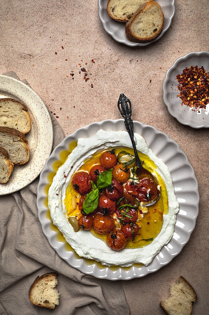 Cherry tomato confit with ricotta and baguette