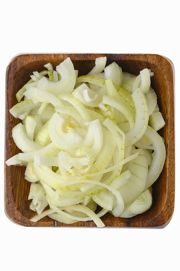 Chopped onions in a wooden bowl