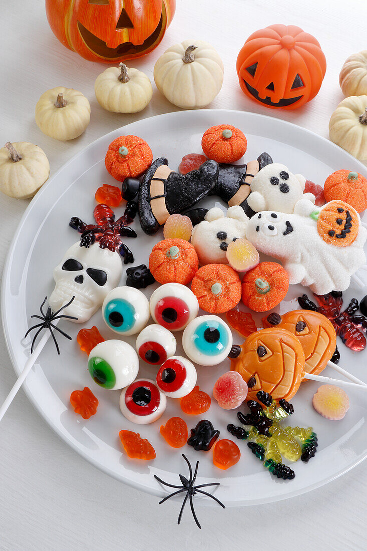 Candy selection for Halloween with pumpkin decoration