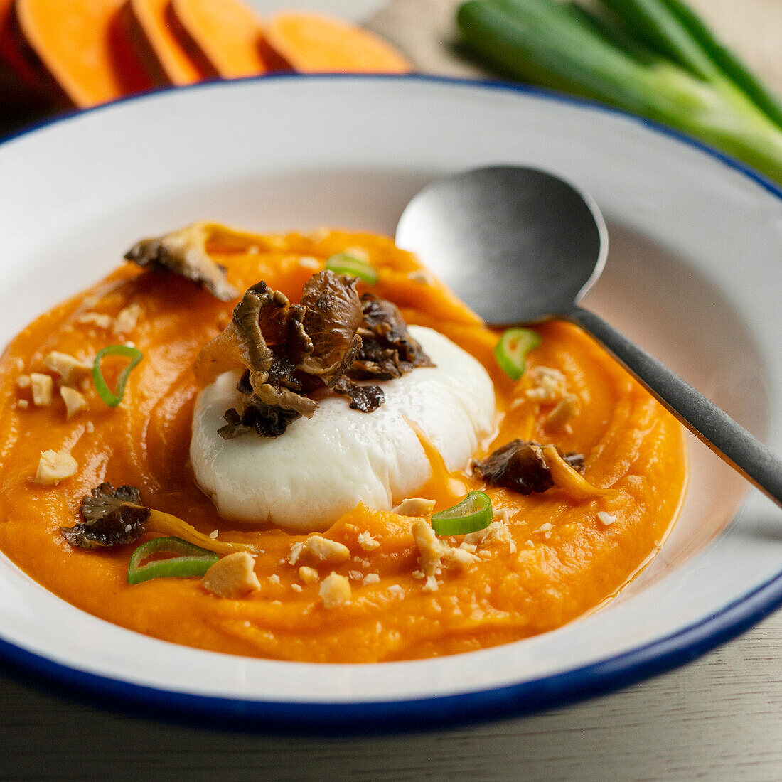 Sweet potato cream with mushrooms and poached egg