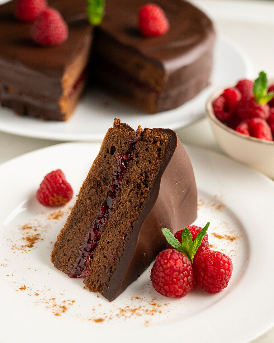 Sacher cake with raspberry filling and fresh raspberries