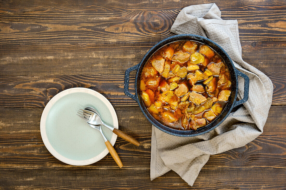 Braised pork and vegetables in a pan