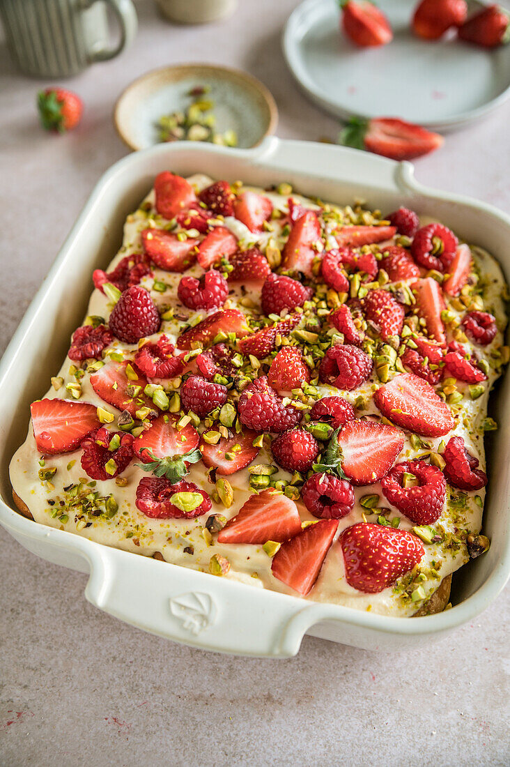 Tiramisu dessert with strawberries, raspberries and pistachios