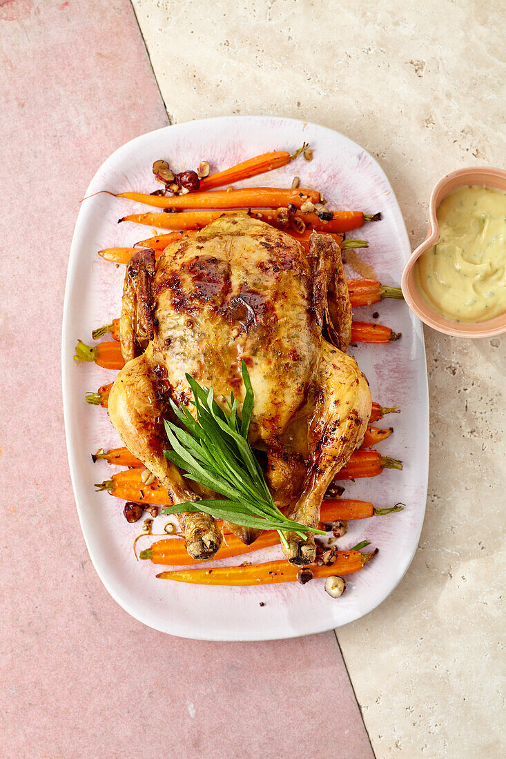 Butter roast chicken on hazelnut carrots