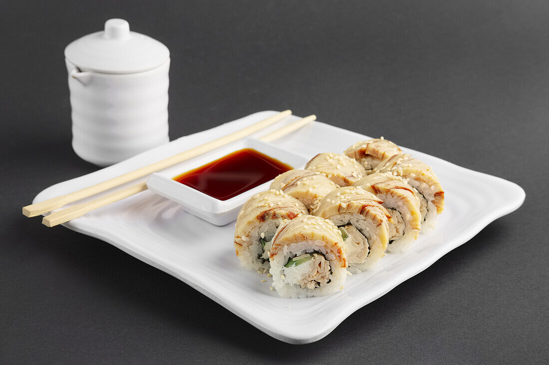 Sushi with teriyaki chicken and soya sauce