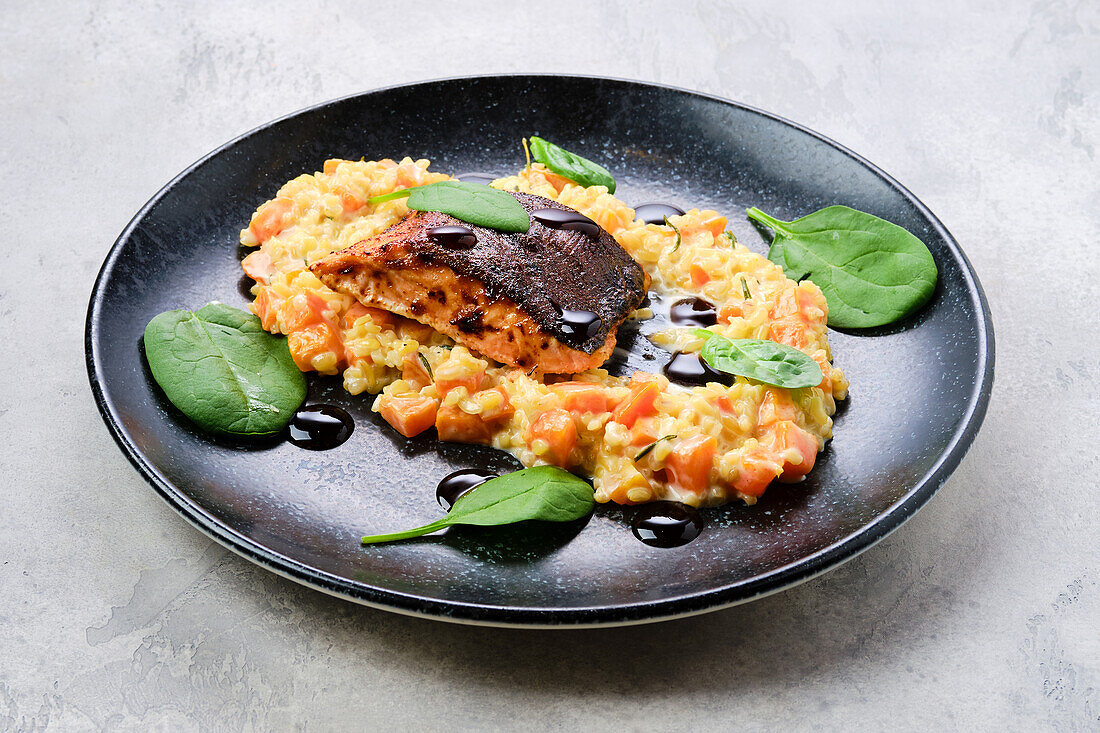 Roast salmon steak with bulgur and sweet potato puree