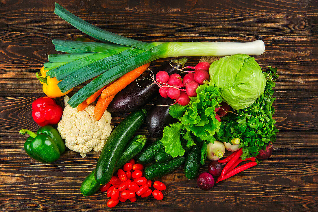 Still life of fresh vegetables on a wooden surface