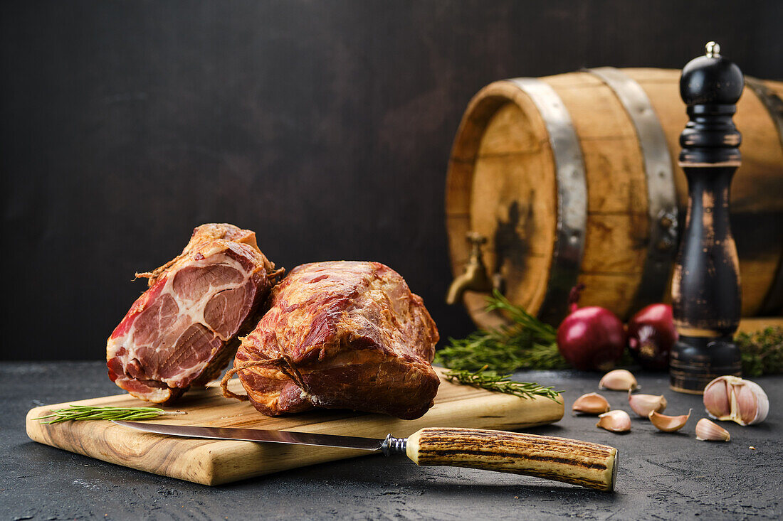 Seasoned, air-dried lamb neck on a wooden board