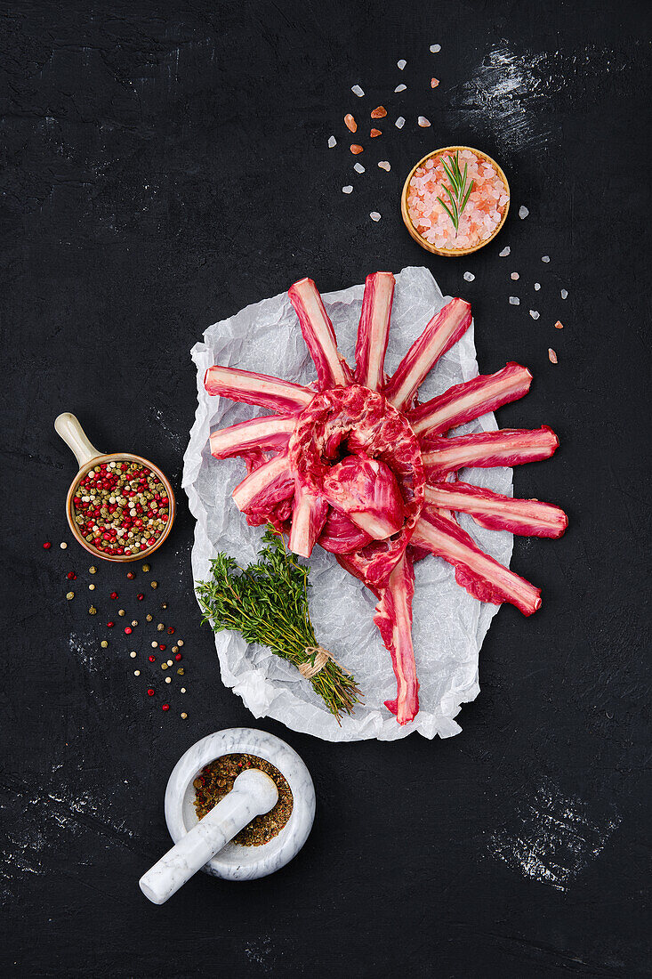 Rack of lamb with herbs and spices on wrapping paper