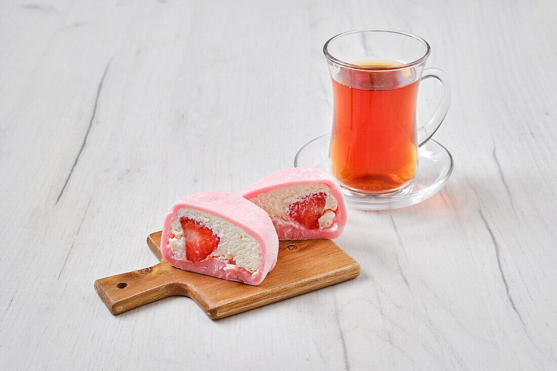 Mochi with strawberry filling and fruit tea