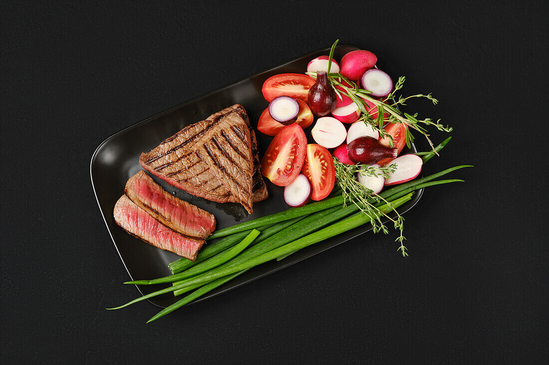 Grilled tri-tip beef steak with vegetables