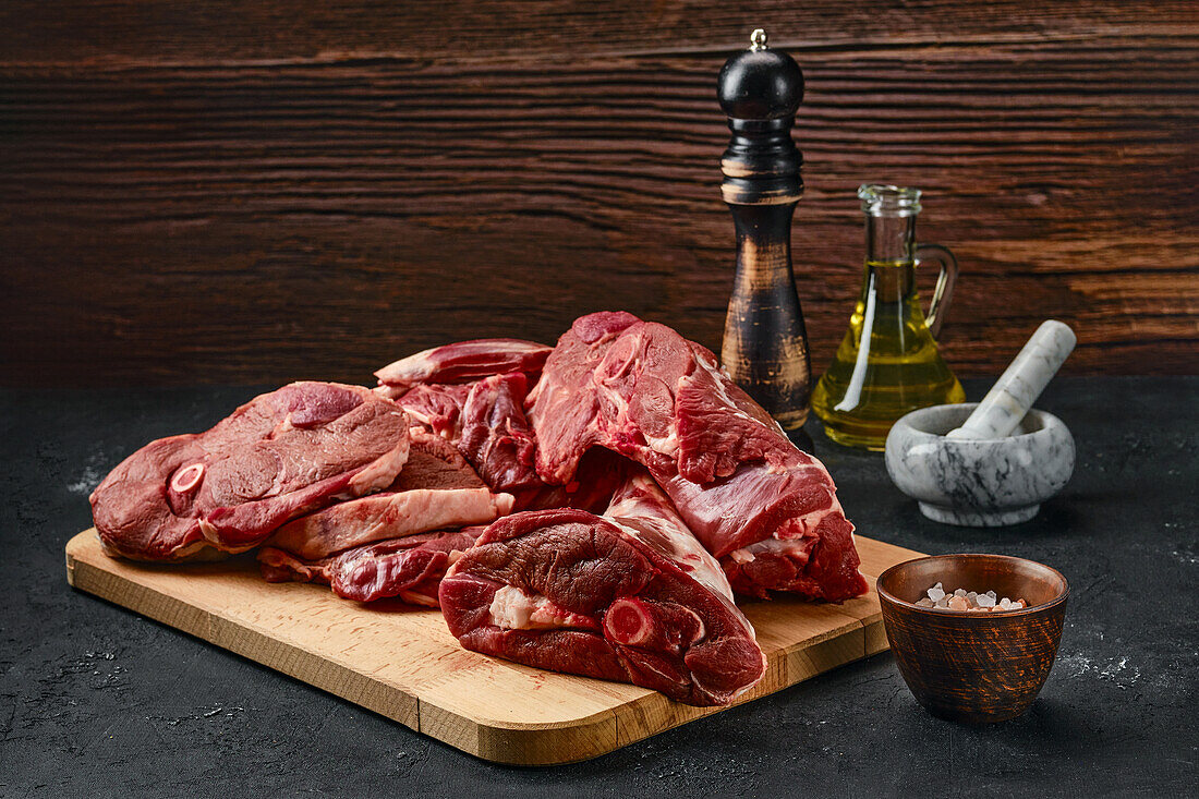 Pieces of raw lamb on a wooden board