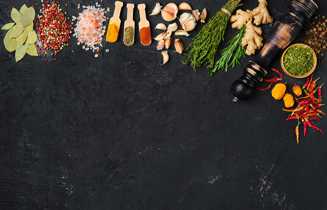 Spices and herbs on a dark background