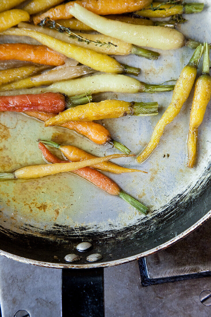 Caramelised coloured carrots in a pan