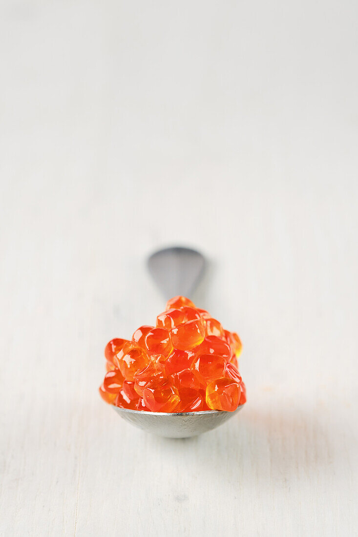 Salmon caviar on a spoon