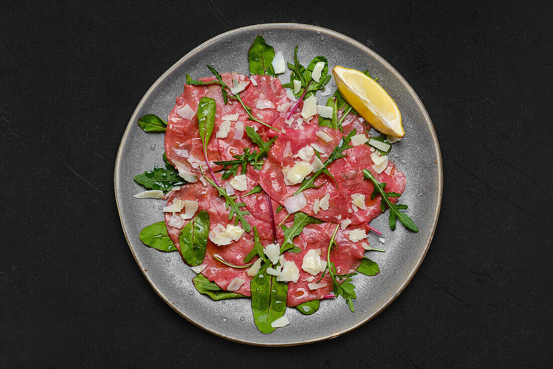 Beef carpaccio with rocket and parmesan