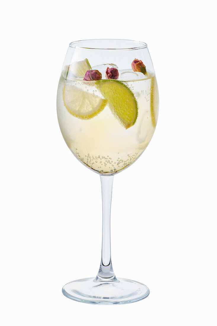 White sangria with limes, lemons and rosebuds