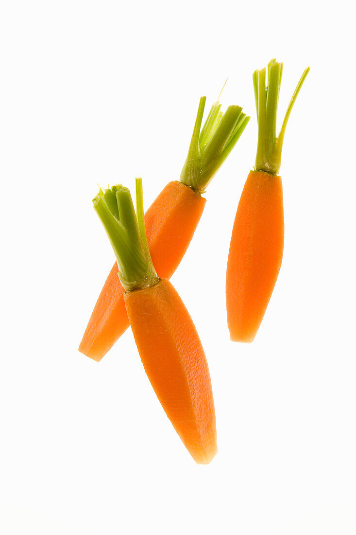 Peeled carrots with greens