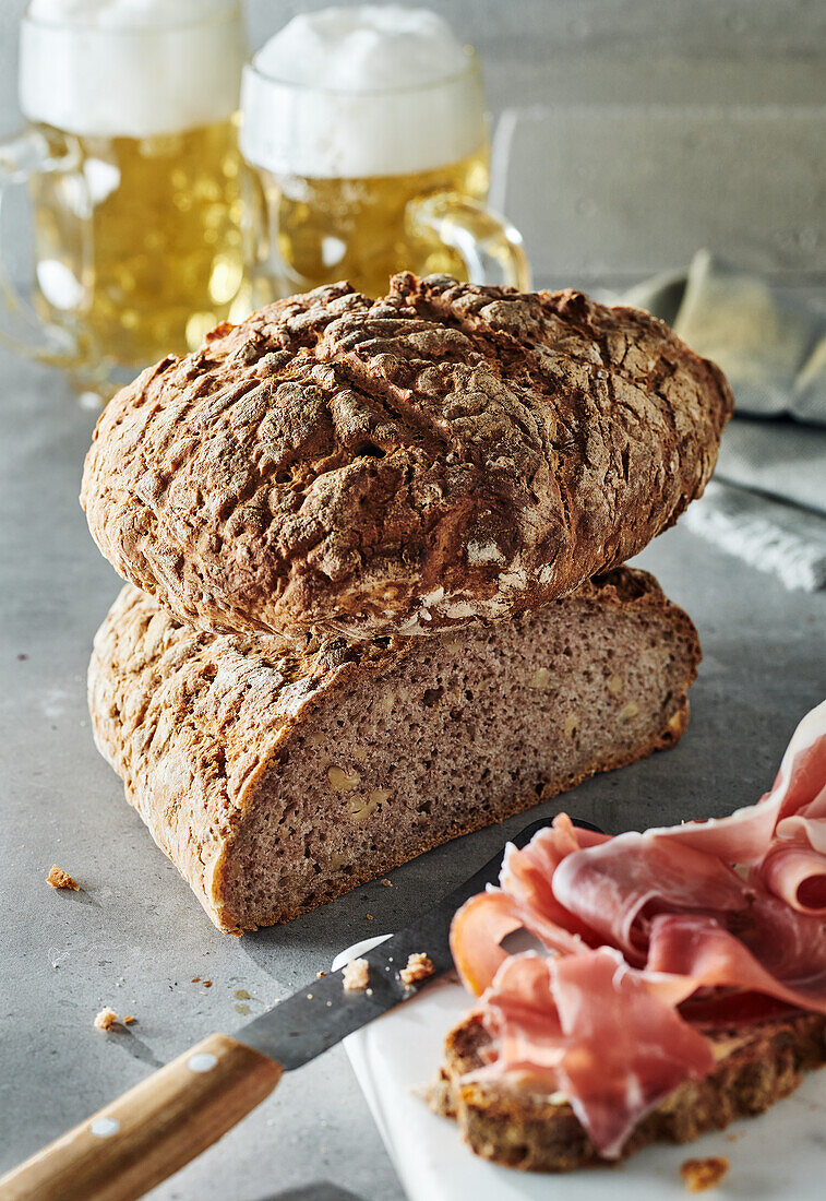 Homemade walnut bread with ham and beer