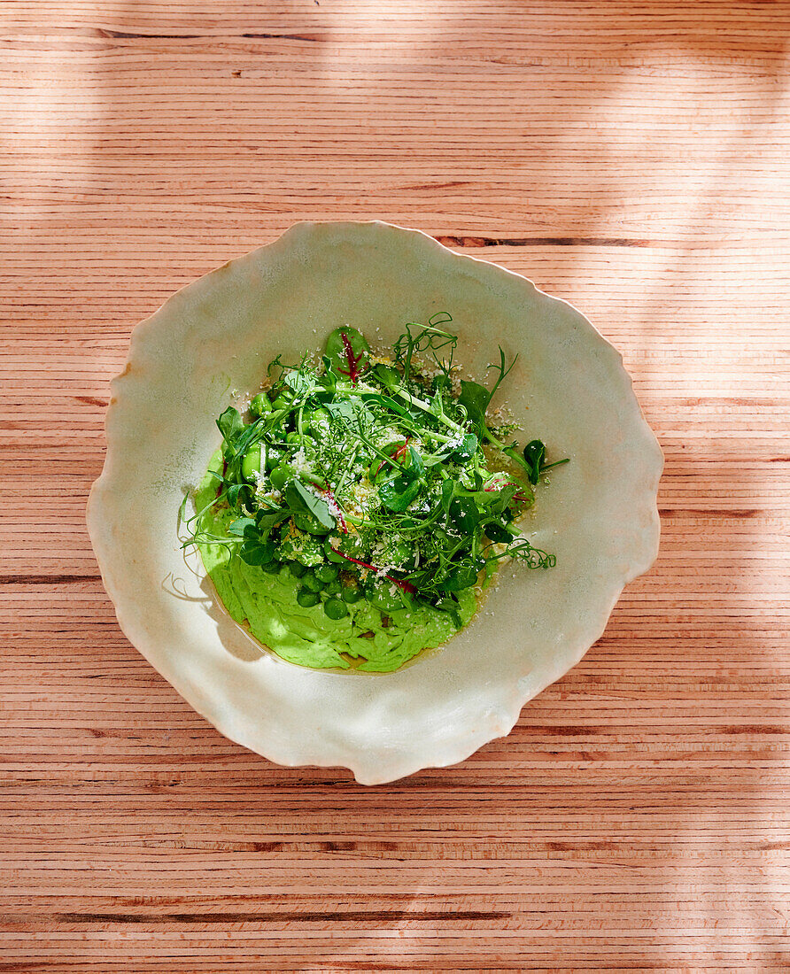 Pea risotto with herb garnish